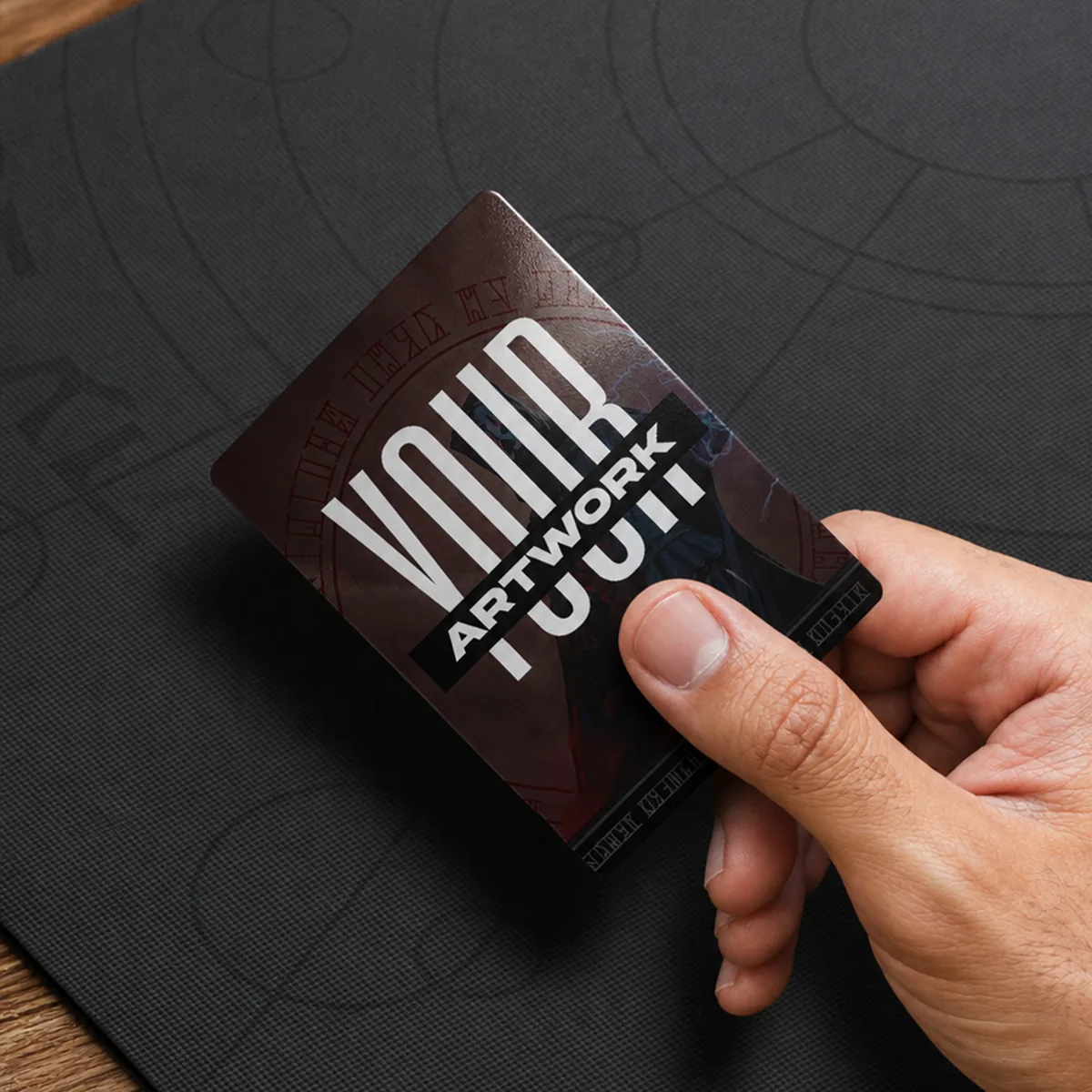 A hand holding a card that reads Your Artwork